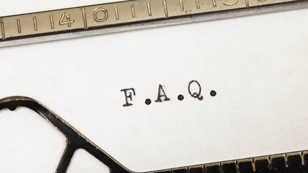 FAQ written on old typewriter.