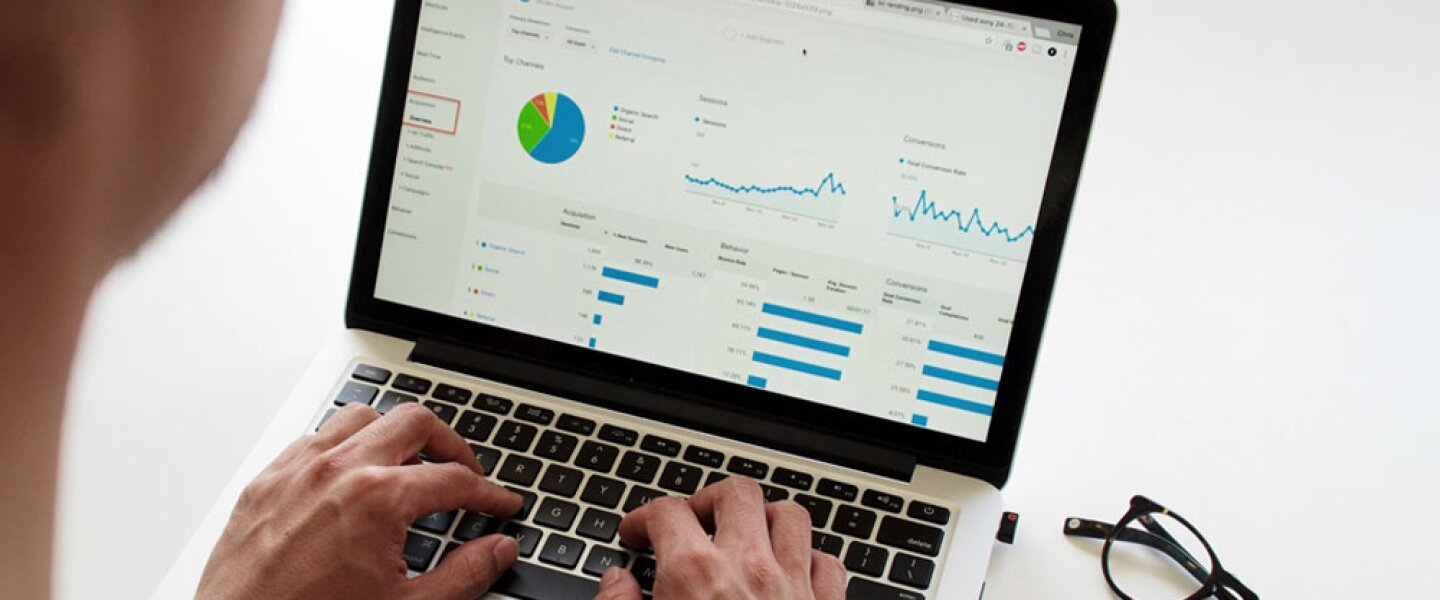 A Person looking investing dashboard via laptop